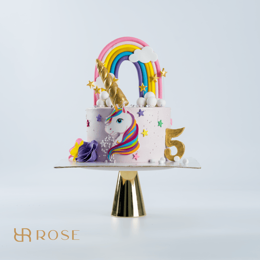 A Birthday Cake to Remember: Our Enchanting Unicorn Cake with Rainbow and Custom Number!